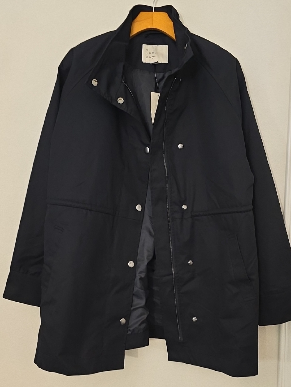a new day Black Coat with White Label